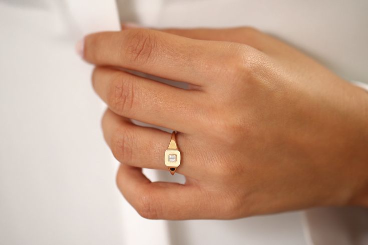 "Baguette Diamond Pinky Ring in 14k Solid Gold / Diamond Signet Ring / Simple Classic Minimalist Baguette Pinky Ring / Diamond Ring Item Details *Made to Order *Gold Kt: 14K (also available in 18K & Platinum upon request) *Available Gold Color: Rose Gold, Yellow Gold, White Gold *Baguette Diamond: 2 pcs 3 x 1.25 MM *Total CTW: 0.09 * Diamond Color-Clarity: G Color VS2 Clarity *Ready to Ship in 7-10 Business Days If you have any additional questions about this ring, just hit the \"Message Fer Classic Baguette Rings For Everyday, Classic Everyday Diamond Signet Ring, Everyday Classic Diamond Signet Ring, Minimalist Signet Ring With Single Cut Diamonds, Classic Diamond Signet Ring For Everyday, Modern 14k Gold Signet Ring With Single Cut Diamonds, 14k Gold Baguette Rings With Baguette Diamonds, Minimalist Baguette Diamond Ring, Elegant Everyday Initial Ring With Polished Finish