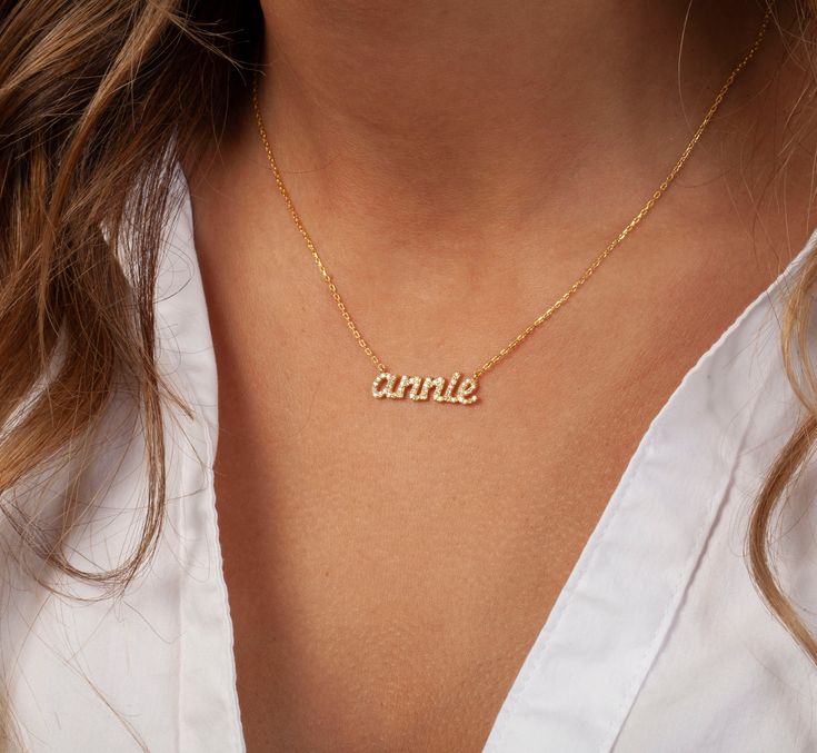 This 14k personalized diamond name necklace is the perfect gift for the bridal party, someone special, or yourself.__________________________________________M A T E R I A L & L E N G T HAvailable in 14k Yellow Gold, 14k Rose Gold, 14k White Gold, Sterling SilverStone: Natural DiamondsThickness: 1.2mm / 0.05"InitialsLowercase: 5 mmCapital: 9 mmDiamond: 0.15 ct. - 0.40 ct. depending on the name Chain length: 14+2, 16+2, 18+2 options or ant length up to 20 inches without extension. Please leave a n Personalized Diamond Necklace For Birthday, Custom Name Fine Jewelry Nameplate Necklace, Custom Nameplate Necklace In Fine Jewelry Style, Customizable Dainty 14k Gold Name Necklace, Customizable Gold Name Necklace For Wedding, Personalized Initial Pendant Name Necklace For Anniversary, Elegant Personalized White Name Necklace, 14k Gold Name Necklace In White, White Diamond Name Necklace As Gift