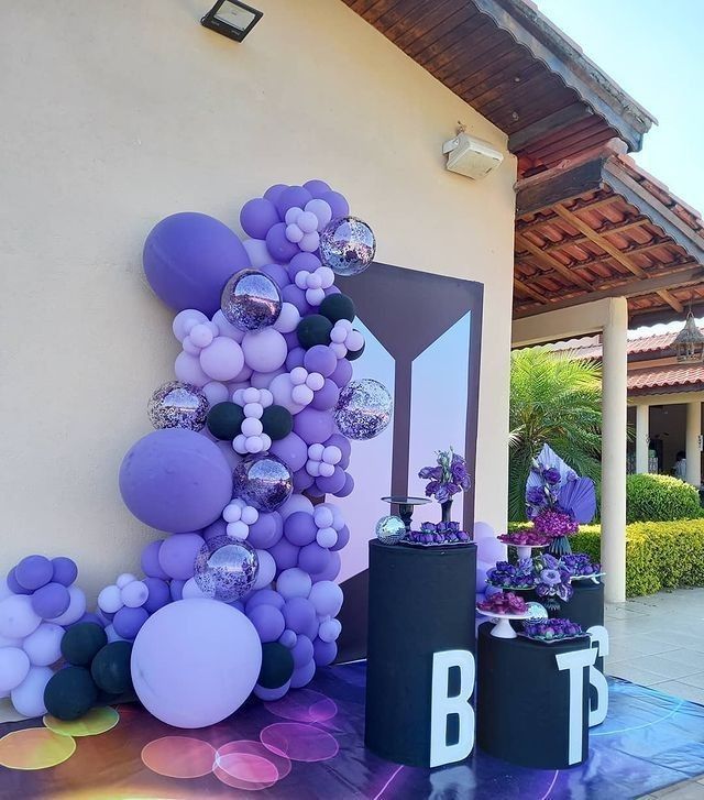 balloons and decorations are displayed on the side of a building