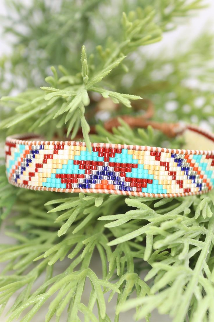 Introducing our adjustable southwestern beaded cuff bracelets! This colorful cuff bracelet is handmade with a southwestern-inspired pattern in cream, dark red, blue, orange, turquoise, and soft yellow.The bracelet is strung on strong beading thread and flexible leather cord with an adjustable closure, making it easy to put on and take off, while also allowing you to customize your fit. It will fit 6-8 inch wrists.Whether you're dressing up for a special occasion or just accenting your everyday s Bohemian Beaded Bracelets With Adjustable Band, Bohemian Multicolor Beaded Bracelets With Adjustable Band, Bohemian Multicolor Beaded Bracelet With Adjustable Band, Bohemian Multicolor Bracelets With Adjustable Band, Bohemian Multicolor Bracelet With Adjustable Band, Multicolor Bohemian Bracelet With Adjustable Band, Multicolor Southwestern Style Bracelet For Gift, Resizable Multicolor Beaded Hippie Bracelets, Bohemian Beaded Bracelet With Adjustable Band