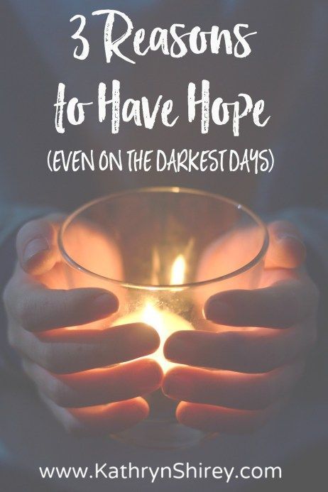 someone holding a candle in their hands with the words 3 reasons to have hope even on the darkest days