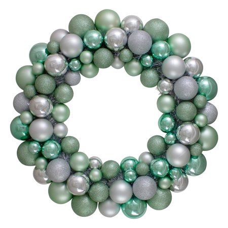 a green and silver christmas ornament wreath