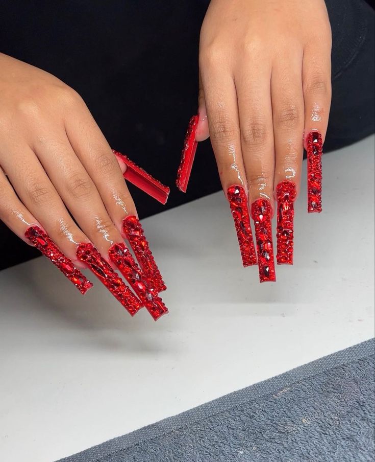 Red Nail Gem Designs, Diamond Red Nails, Extra Long Red Nails, Red Diamond Nails Rhinestones, Red Long Acrylic Nails With Rhinestones, Red Boujee Nails, Red Bedazzled Nails, Red Nails With Red Rhinestones, Red Stone Nails