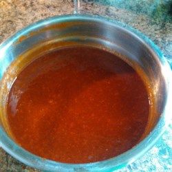 a metal bowl filled with liquid on top of a counter