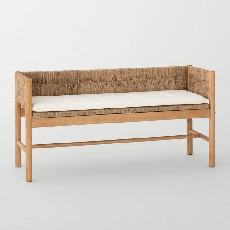 a wooden bench with a cushion on it