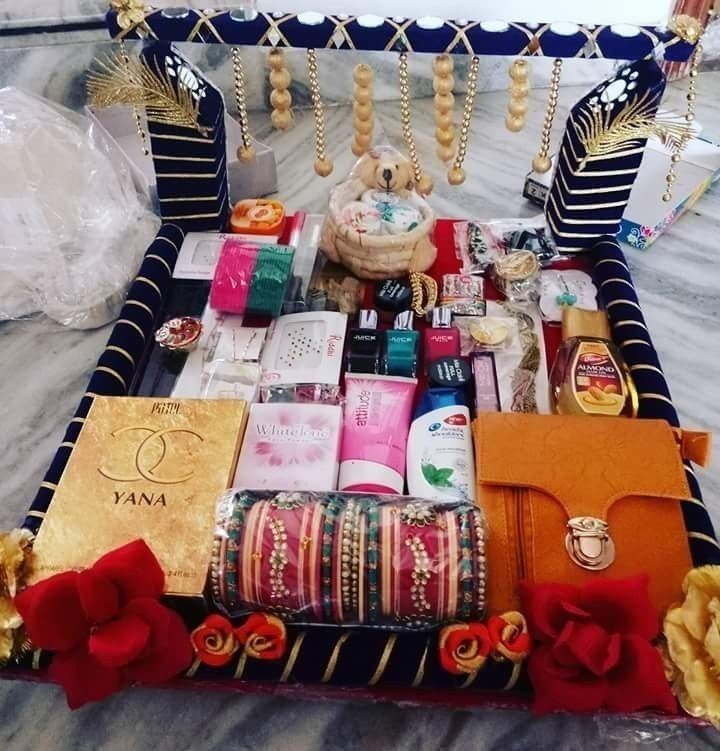 an elaborately decorated bed with many items on it