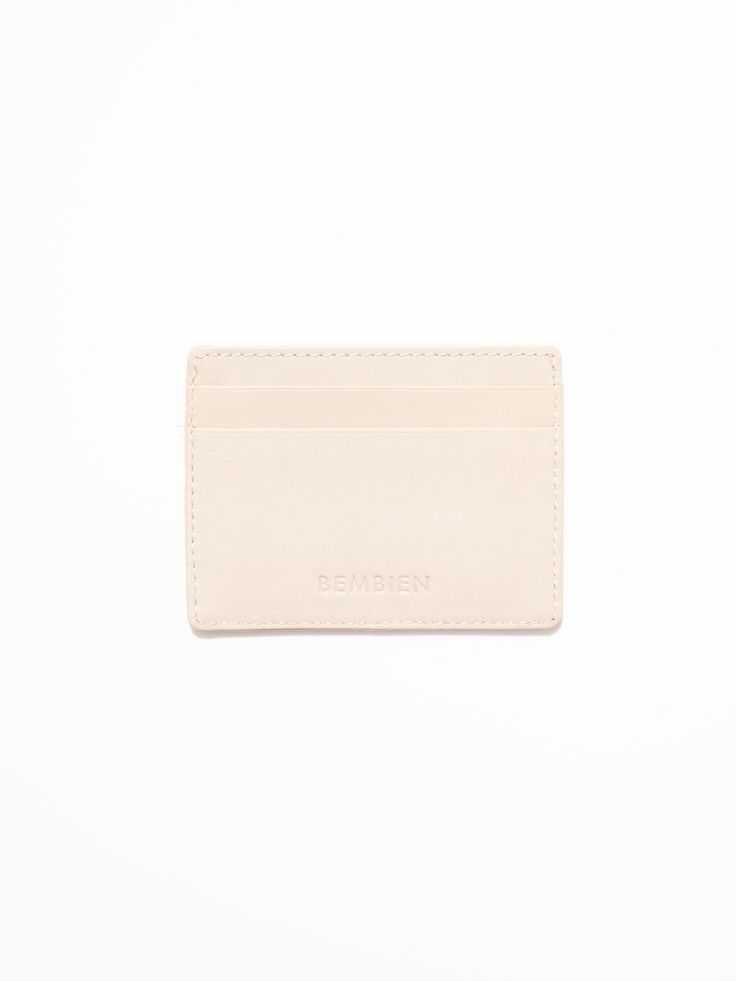 A slim, minimalist card case to hold your essentials. Use it every day or as an occasional piece when carrying a smaller bag or evening clutch. It features two card slots and a pocket to tuck away loose bills (or love notes). 100% woven leather 2x card slots | 1x slip pocket 4 inches x 3 inches Handwoven in India Everyday Beige Card Holder With Interior Slots, Everyday Use Beige Card Holder With Interior Slots, Beige Rectangular Card Holder For Travel, Classic Compact Card Holder, Versatile Pouch With Interior Card Slots For On-the-go, Minimalist Cards, Evening Clutch, Original Card, Love Notes