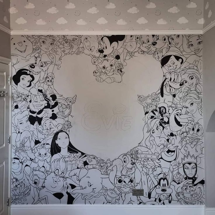 a bathroom with cartoon characters painted on the wall and in the bathtub is a large heart