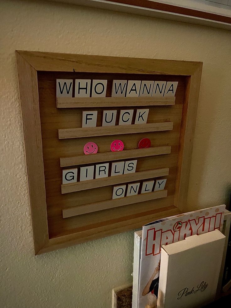 a wooden framed sign that says who wannan't fuk girls only?