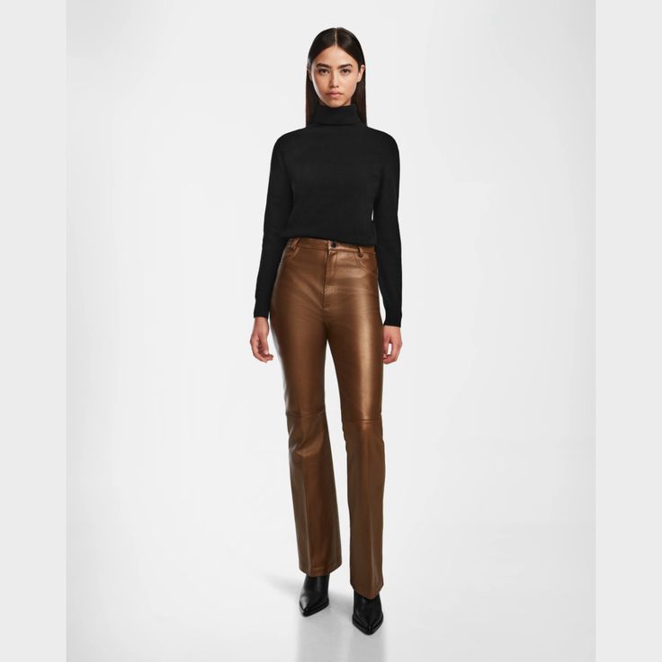 Turn heads with the CARISSA by RUDSAK, a women's pair of flare leather pants designed in luxe, supple leather. These striking pants feature hip and back pockets, blending practicality with high-fashion appeal. The flattering flare silhouette adds a touch of retro chic, perfect for elevating any outfit. Whether for a night out or a stylish day look, the CARISSA pants offer a bold statement piece for those who appreciate both elegance and edge in their wardrobe. Flare Leather Pants, Pants Design, Retro Chic, Antique Bronze, Blending, High Fashion, Leather Pants, Night Out, Wardrobe