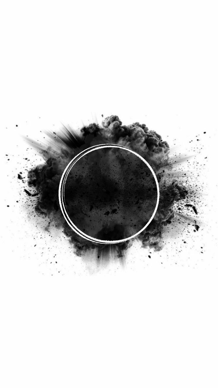 black ink splattered on white paper with a circular frame in the middle,