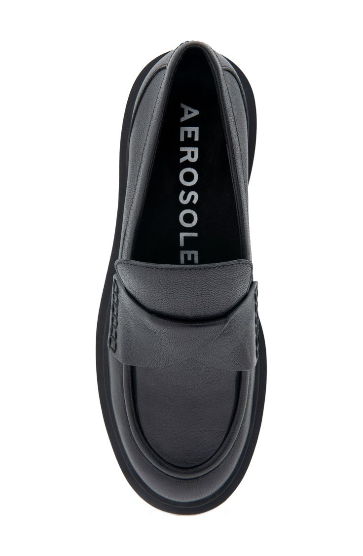 This updated penny loafer offers both modern style and effortless comfort thanks to a cushioned footbed and lightweight, flexible sole. OrthoLite® footbed Leather upper/synthetic and textile lining/synthetic sole Imported Synthetic Slip-on Loafers With Leather Sole, Modern Slip-ons With Ortholite Insole For Work, Leather Slip-on Platform Loafers With Cushioned Footbed, Leather Platform Loafers With Cushioned Footbed, Modern Slip-on Moccasins With Leather Footbed, Modern Flat Loafers With Branded Insole, Business Loafers With Ortholite Insole, Modern Synthetic Loafers, Modern Slip-on Platform Loafers In Synthetic