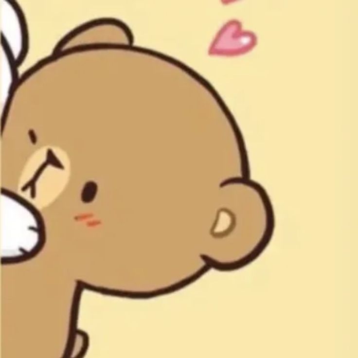 a brown teddy bear holding onto the side of a wall with hearts coming out of it