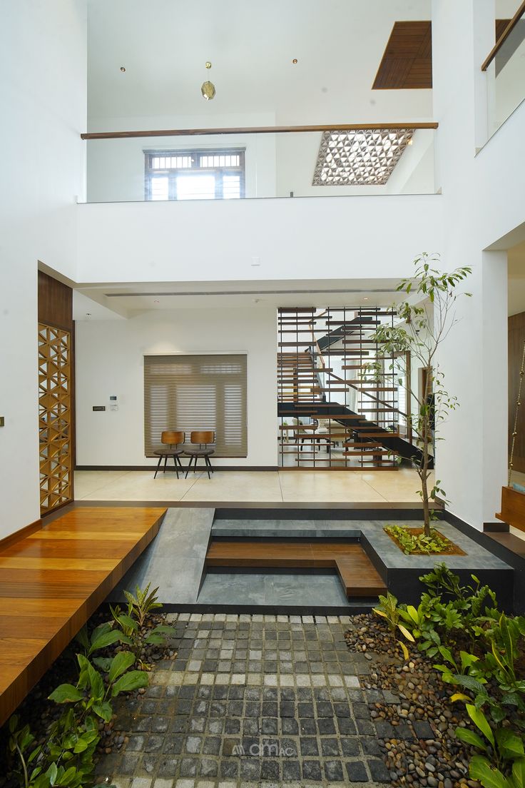 the inside of a house with wood and stone flooring