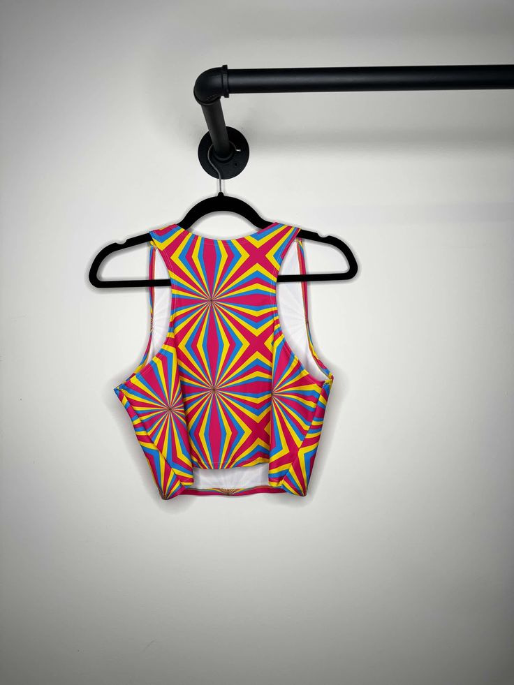 Seller Notes: Crop Top 
FRW Exclusive!
Made on Recycled Material ♻️
85% Recycled PET Polyester 15% Spandex
Made in San Diego, CA; Condition: New Without Tags; This item is sold directly from Freedom Rave Wear, and might be samples, production units, returned items, or more; Freedom Rave Wear Rave Wear, San Diego, Crop Top, Crop Tops, Spandex, Pet, Tags, How To Wear