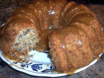 a bundt cake on a plate covered in caramel