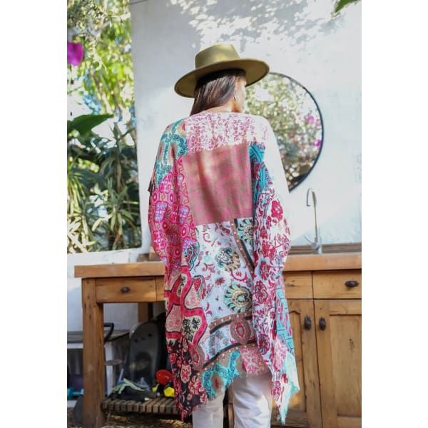 Introducing our stunning BoHo Gypsy floral patchwork kimono, the ultimate must-have for your fall wardrobe! 🌸✨ This lightweight layering piece is designed to elevate your style game effortlessly. Pair it with flared jeans for a chic and bohemian look that will turn heads wherever you go. Embrace the beauty of autumn with our exquisite kimono, adorned with vibrant floral patterns and intricate patchwork details. Get ready to make a statement and embrace your inner free spirit with this fashion-f Spring Beach Kimono With Patchwork, Bohemian Long Sleeve Patchwork Kimono, Multicolor Patchwork Summer Kimono, Bohemian Multicolor Patchwork Kimono, Casual Patchwork Kimono For Fall, Pink Hippie Kimono For Summer, Summer Hippie Pink Kimono, Multicolor Flowy Kimono For Fall, Flowy Multicolor Fall Kimono