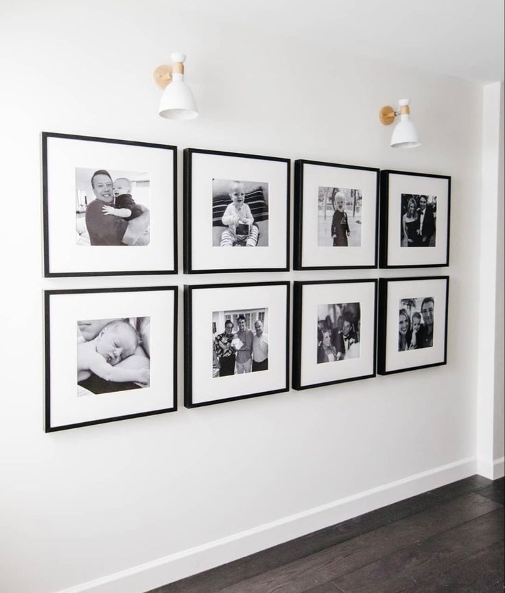 black and white photographs hanging on the wall