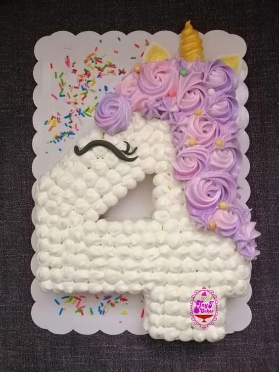 a cake made to look like a unicorn with sprinkles