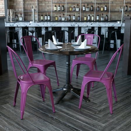 purple chairs around a small table in a restaurant