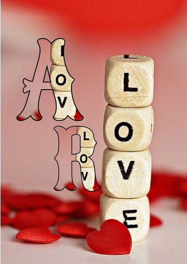 the word love spelled with wooden blocks and hearts