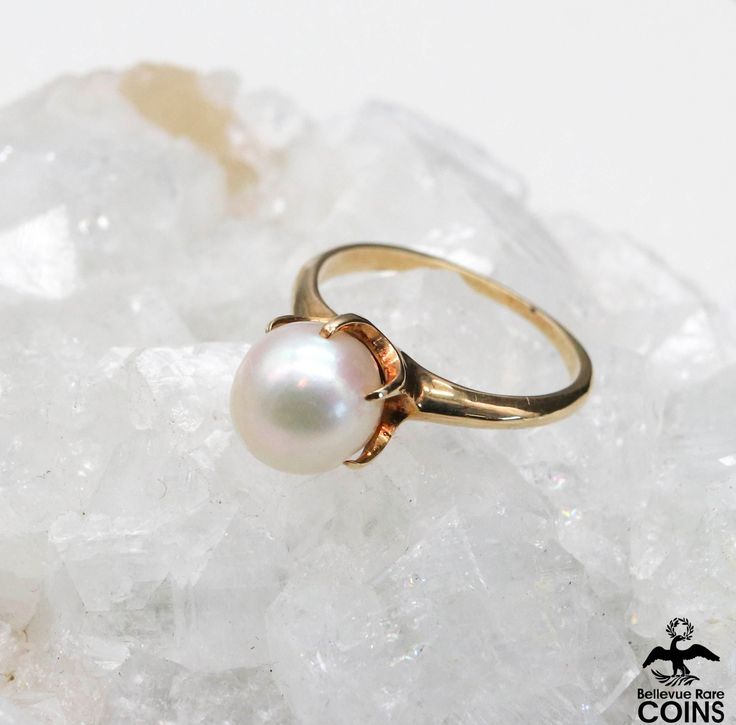 Metal: 14k Yellow Gold Weight: 2.7 grams Ring Size: 4.75 (US) Pearl Size: ~7.80 mm *This Mikimoto ring, crafted from 14k yellow gold, exemplifies the fusion of simplicity and modernist artistry. * P L E A S E * S E E * P H O T O S!! 14k Gold Pearl Ring With Polished Finish, Timeless 14k Gold Pearl Ring, Classic 14k Gold Pearl Ring, Timeless Round 14k Gold Pearl Ring, 14k Yellow Gold Pearl Ring With Polished Finish, 14k Yellow Gold Polished Pearl Ring, Classic Yellow Gold Pearl Ring With Round Band, Formal Solitaire Pearl Ring In Yellow Gold, Formal Yellow Gold Solitaire Pearl Ring