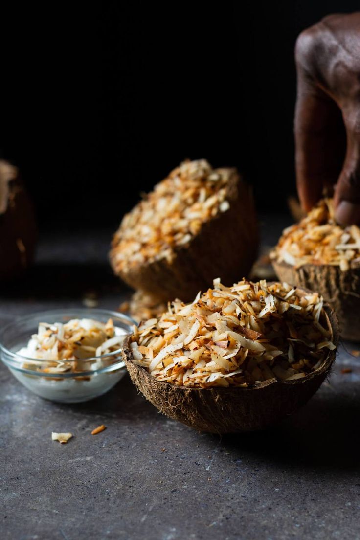 coconut muffins with toasted coconut and shredded coconut flakes on the side