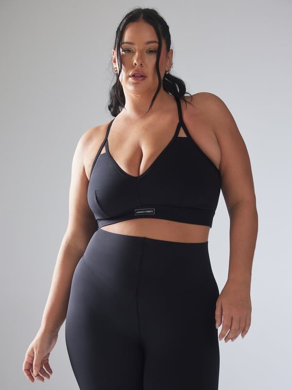 Always the main attraction. Our Spotlight Low-Impact Sports Bra features a fully lined bust, a strappy back with an O-ring, and adjustable straps. Sports Bra With Built-in Padding For Light Exercise, Fitted Sporty Bra, Sporty Fitted Bra With Straps, Strappy Back Nylon Sports Bra For Workout, Nylon Workout Sports Bra With Strappy Back, Nylon Strappy Back Sports Bra For Workout, Sporty Fitted Bra, Athleisure Activewear With Removable Bra Pads And Racerback, Strappy Sports Bra With Light Support And Stretch