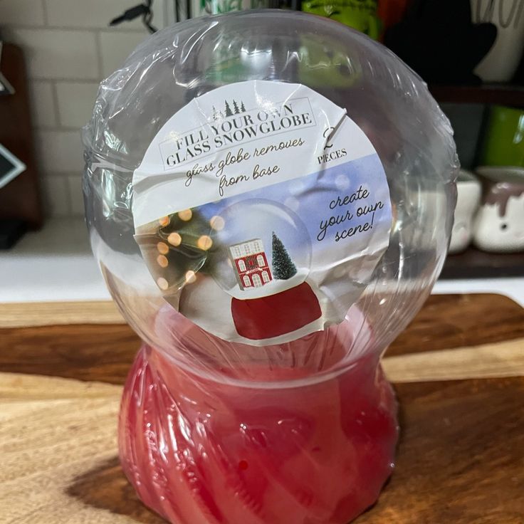 a snow globe sitting on top of a wooden table