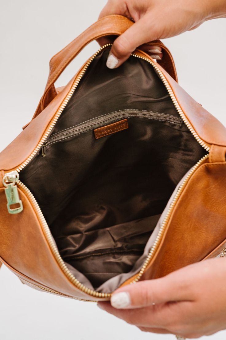 The Reese Backpack comes in two sizes (standard and oversized) to fit all you'll need to carry on the go, without looking like you're about to check your luggage. Toss in any size laptop, books, keys, wallet, and even an extra pair of shoes... without looking like you're about to go on a 12-mile hike! Each gorgeous neutral color comes in ultra-soft and durable vegan leather. The Reese features adjustable backpack straps and a top handle for a quick grab. It has two exterior pockets (one front an Brown Travel Satchel For Back To School, Brown Backpack With Zipper Pocket For On-the-go, Brown Satchel For Travel And Back To School, Brown Bags With Zipper Closure For Back To School, Brown Travel Bag For Back To School, Rectangular Leather Backpack For Everyday, Rectangular Leather Backpack With Zipper For Everyday, Large Capacity Tote Backpack For On-the-go, On-the-go Laptop Backpack With Zipper Pocket