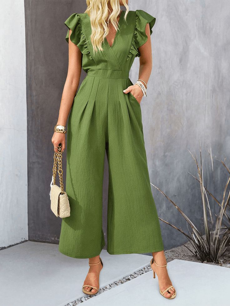 Unleash your inner fashion icon with the All Time Classic Wide Pants Jumpsuit. This classic and timeless piece features wide leg pants that provide comfort and effortless style. Perfect for any occasion, this jumpsuit is a staple in any wardrobe. Upgrade your fashion game today! Size Guide: Model is 5’85” tall, and has a 34.1” bust, 24.2” waist, & 35.7” hips. She is wearing a S / US 4 / AU 8. This jumpsuit is true to size. Material: 95% Polyester, 5% Elastane Feature: V-Neckline. Ruffle shoulder. Wide leg. Not lined. Back button closure. Relaxed fit. Care Instructions: Machine wash / Cold hand wash Chic Solid Overalls With Pockets, Trendy Wide Leg Jumpsuits And Rompers For Summer, Non-stretch Wide Leg Jumpsuits And Rompers, Chic Wide Leg Overalls For Work, Elegant Wide Leg Jumpsuits And Rompers With Pockets, Casual Full-length Jumpsuits And Rompers For Spring, Chic High-waisted Summer Jumpsuits, Chic Full-length Non-stretch Jumpsuits And Rompers, Chic Full Length Non-stretch Jumpsuits And Rompers