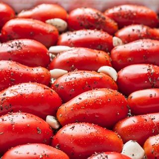 red tomatoes with white and black stuff on them