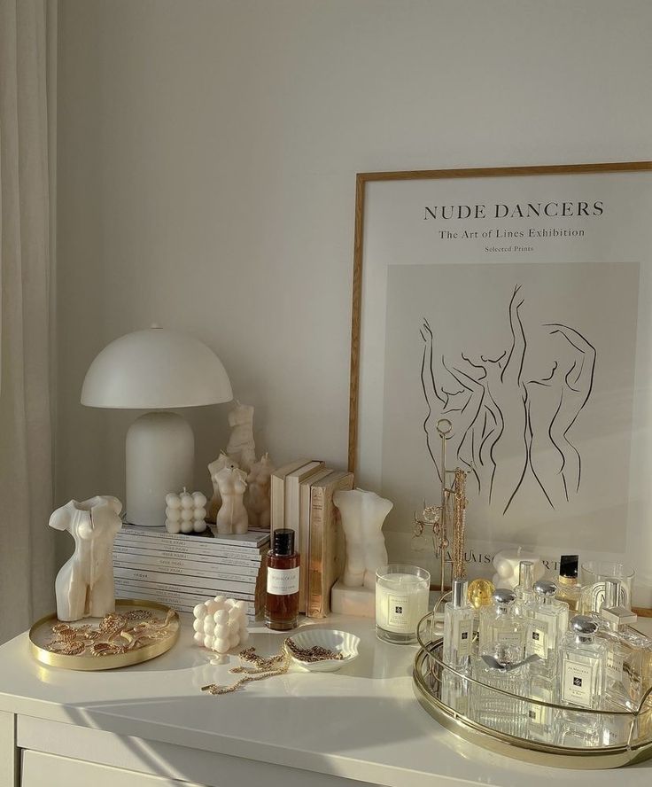 a white dresser topped with lots of candles and other items on it's side