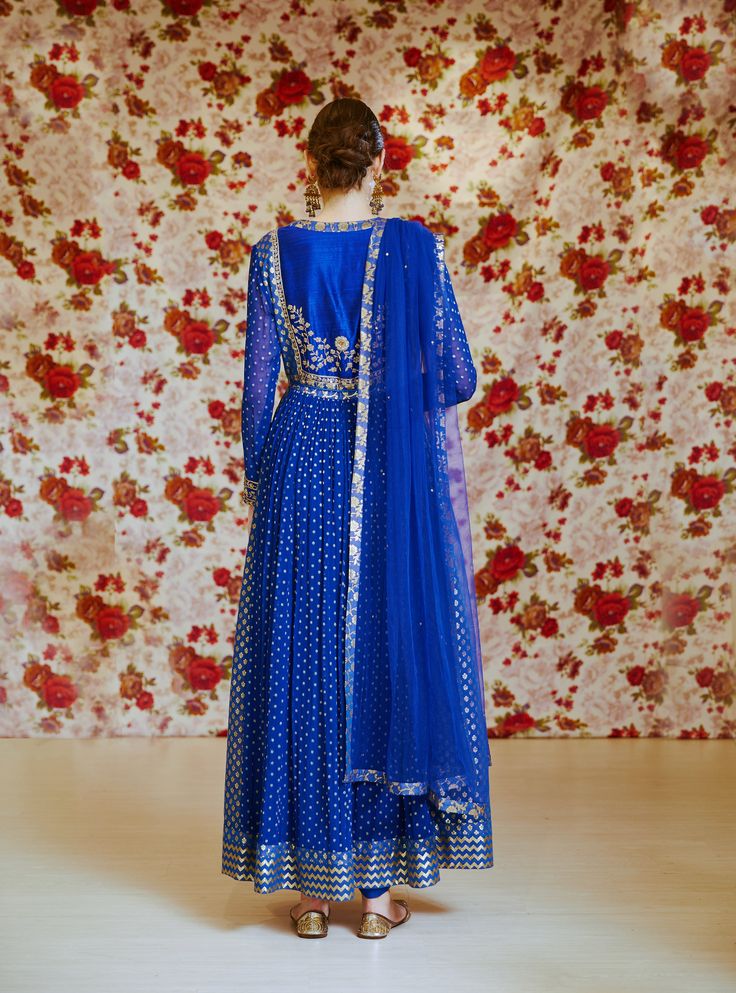 Editor's Note This set features a royal blue embroidered long kurta with dupatta and trouser. Color: Royal Blue Fabric: Silk Chnderi Brocade And Georgette Embroidery Details: Zardozi Care: Dry Clean Only Customize Your Outfit Can't find the size you're looking for? No stress. Just select the size "Custom" while adding the item to your cart. We will follow up with you for your body measurements. To request a color or design customizations, please contact our customer care by using our "Ask us a q Blue Embroidered Floor-length Salwar Kameez, Designer Royal Blue Salwar Kameez For Eid, Royal Blue Semi-stitched Set For Eid, Semi-stitched Royal Blue Bollywood Anarkali Set, Semi-stitched Blue Embroidered Anarkali Set, Fitted Anarkali Salwar Kameez In Royal Blue, Fitted Royal Blue Anarkali Salwar Kameez, Semi-stitched Royal Blue Salwar Kameez With Resham Embroidery, Floor-length Blue Traditional Wear With Resham Embroidery