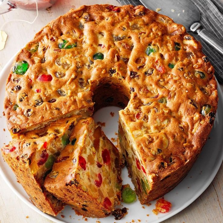 a cake that has been cut into pieces on a plate with one slice missing from it