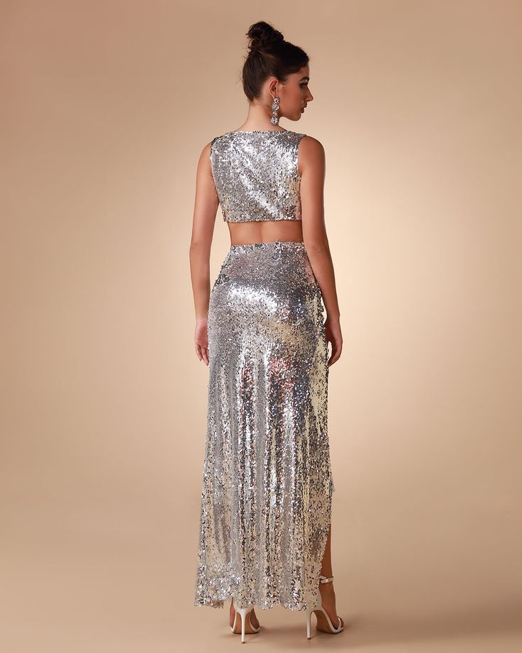 Unleash your inner diva with our Argent Sequin Two Piece Set. Featuring a glittery and glamorous sequin fabric, this two piece ensemble is perfect for making any night out extra special. Cut in a sleek silhouette, it's designed to flatter every figure and bring out your best look. Our Style No.KLYF823 Bead Piece Height - 68.9"/175cm Bust - 34.6"/88cm Waist - 25.6"/65cm Hips - 36.6"/93cm and wears size S About Wholesale/Dropshipping, please contact us! Note: Colour may vary due to lighting on ima Glamorous Festive Sequin Dress For Night Out, Glamorous Sequin Prom Dress For Festive Occasions, Glamorous Sequin Fabric For Gala And Festive Occasions, Glamorous Gala Sequin Dress With Contrast Sequin, Glamorous Festive Sequin Dress With Contrast Sequin, Festive Glamorous Sequin Dress With Contrast Sequins, Glamorous Embellished Sequin Fabric For Prom, Glamorous Festive Contrast Sequin Dress, Sparkling Sequin Fabric For Gala Night Out