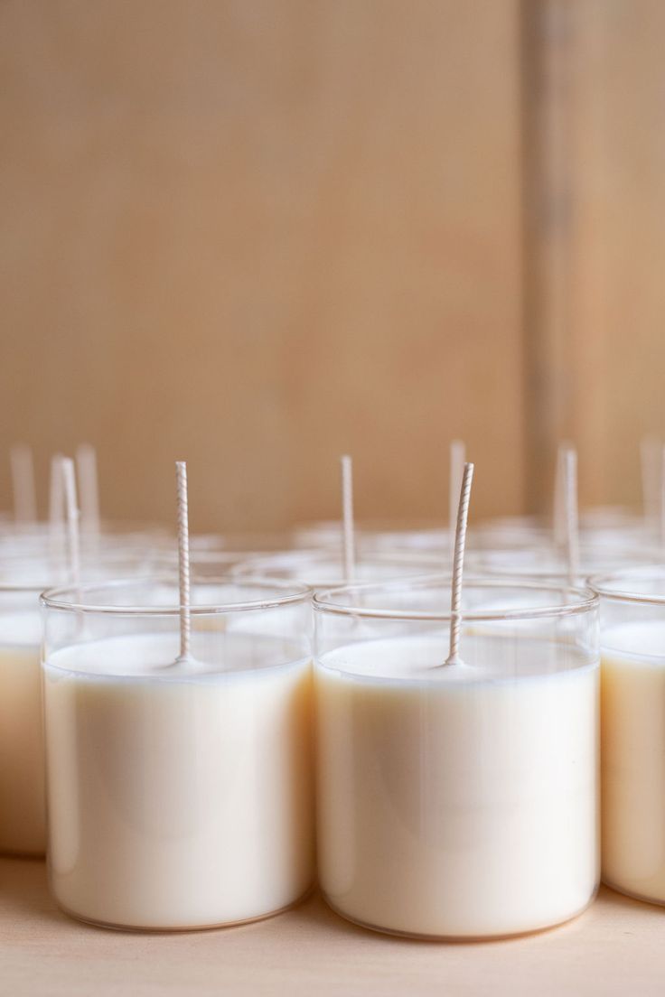 several candles are lined up with toothpicks in them