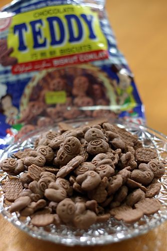 a pile of chocolate chips sitting on top of a glass plate