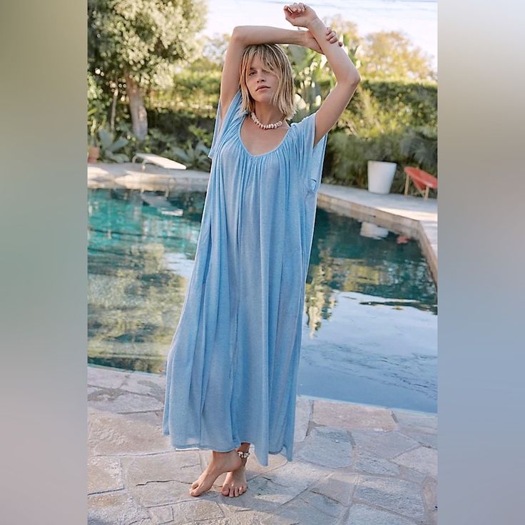 Fit: Relaxed, Shapeless Wide-Leg Silhouette Features: Scoop Neckline, Flutter Sleeves, Low Back, Semi-Sheer Heathered Fabrication, Side Pockets Bust: 51.5 In Hips: 77.25 In Inseam: 21.25 In Sleeve Length: 8.75 In Relaxed Fit V-neck Jumpsuits And Rompers For Vacation, Relaxed Fit V-neck Jumpsuits And Rompers For Beach, Relaxed Fit V-neck Jumpsuit For Beach, Beach-ready Relaxed Fit V-neck Jumpsuit, Summer Beachwear Jumpsuits And Rompers For Poolside, Relaxed Fit Jumpsuits And Rompers For Beach Loungewear, Beach Season Loungewear Jumpsuits And Rompers With Relaxed Fit, Blue Relaxed Fit Jumpsuits And Rompers For Beach, Relaxed Fit V-neck Jumpsuit For Vacation