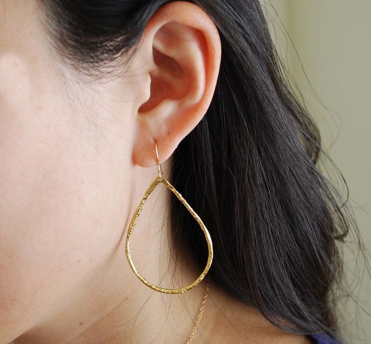 Gold plated teardrop hoops measure 2 inches in length and 1.25 in width. The ear hook is 14k gold fill. Also available in silver. These are great everyday earrings. Item comes packaged in a little brown box. Gold Hypoallergenic Teardrop Earrings For Everyday, Everyday Long Drop Hoop Earrings With Ear Wire, Everyday Gold Teardrop Hoop Earrings, Gold Teardrop Threader Earrings For Everyday, Gold Long Drop Teardrop Earrings For Everyday, Everyday Gold Long Drop Teardrop Earrings, Everyday Long Drop Gold Teardrop Earrings, Yellow Gold Teardrop Hoop Earrings With Ear Wire, Gold Teardrop Threader Single Earring