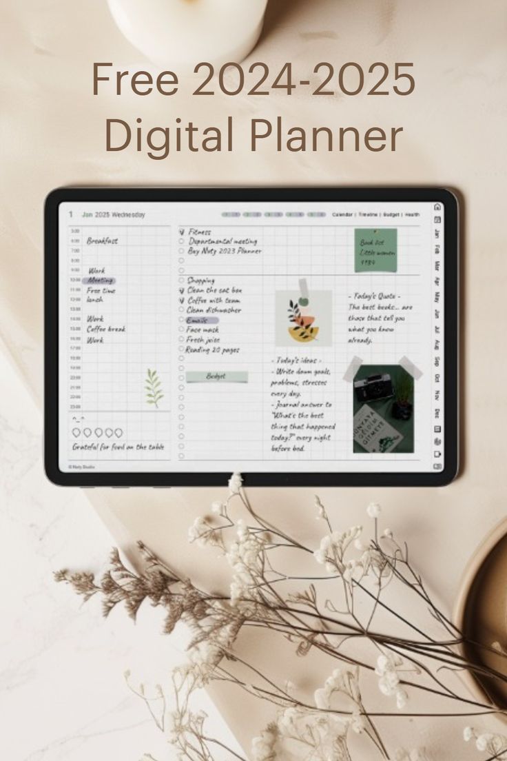 the digital planner is sitting on top of a table next to some flowers and candles