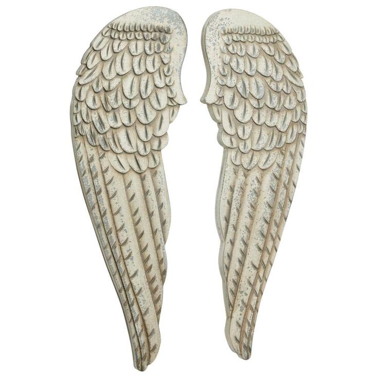 two white angel wings are shown against a white background and one is facing the opposite direction