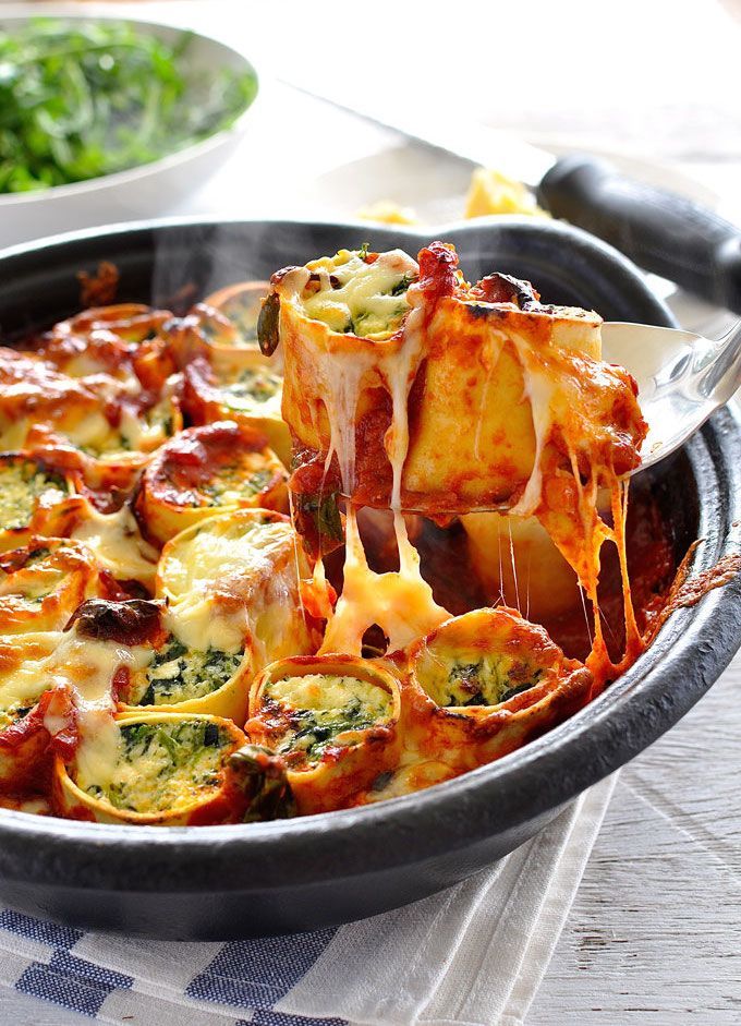 a close up of food being lifted from a skillet