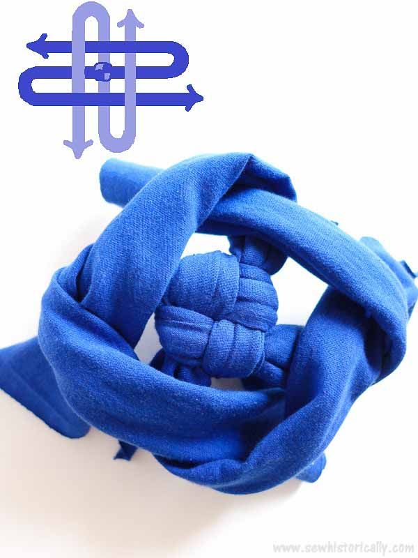 a blue scarf with an arrow pointing to it