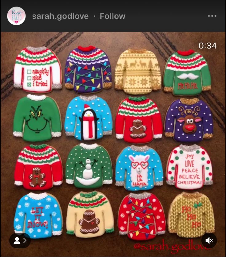 twelve decorated sweaters are arranged in rows on the floor, one is for children