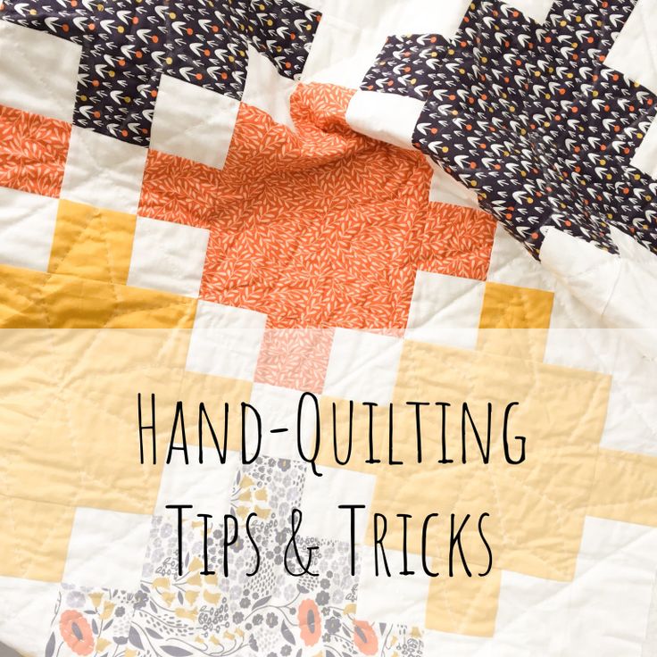 an orange and white quilt with the words hand - quilting tips & tricks on it