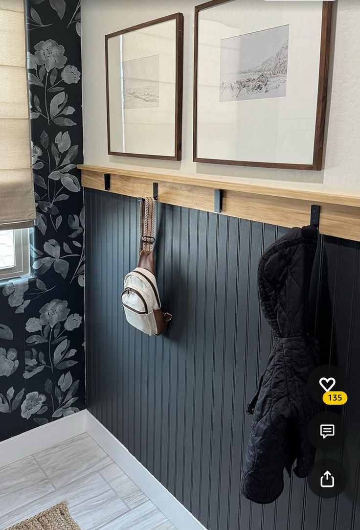 two pictures hanging on the wall above a coat rack