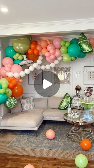 a living room filled with balloons and furniture