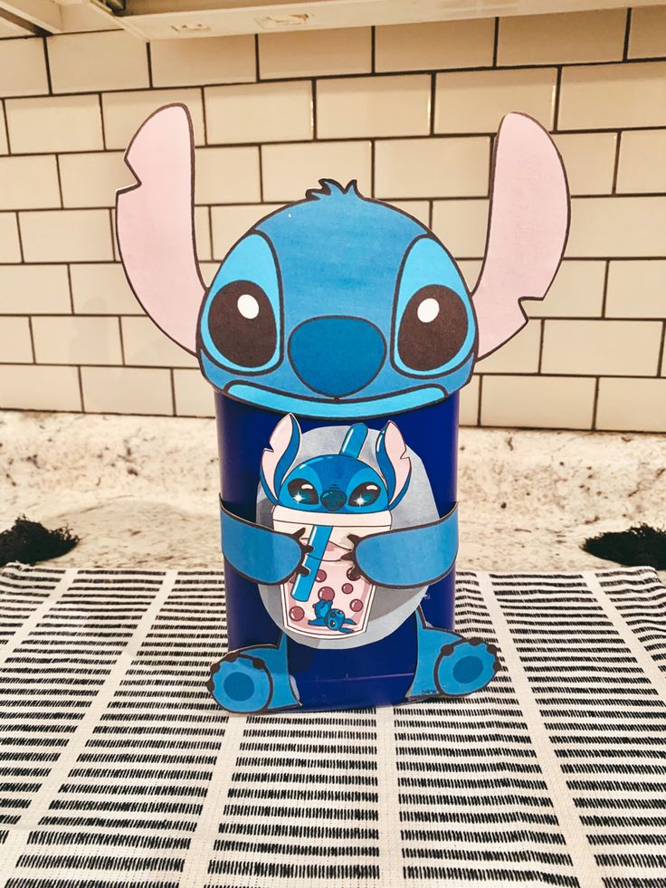 a blue tin with an image of stitcher from the movie stitchers on it