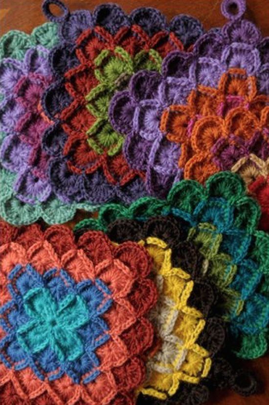 crocheted coasters are arranged on a table